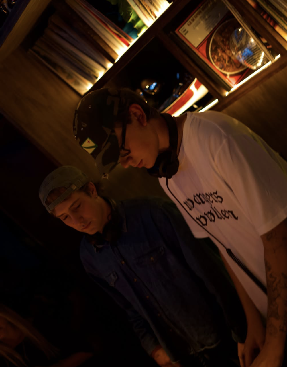Hidden Grooves DJs at a record store